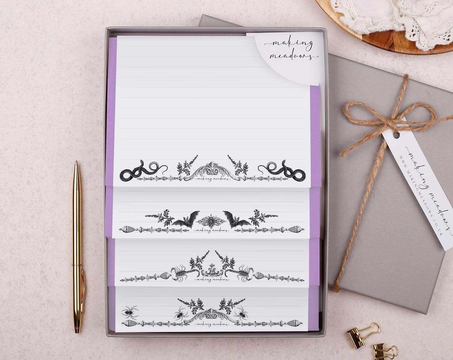 Gothic writing set with bats, snakes, scorpions, and spiders