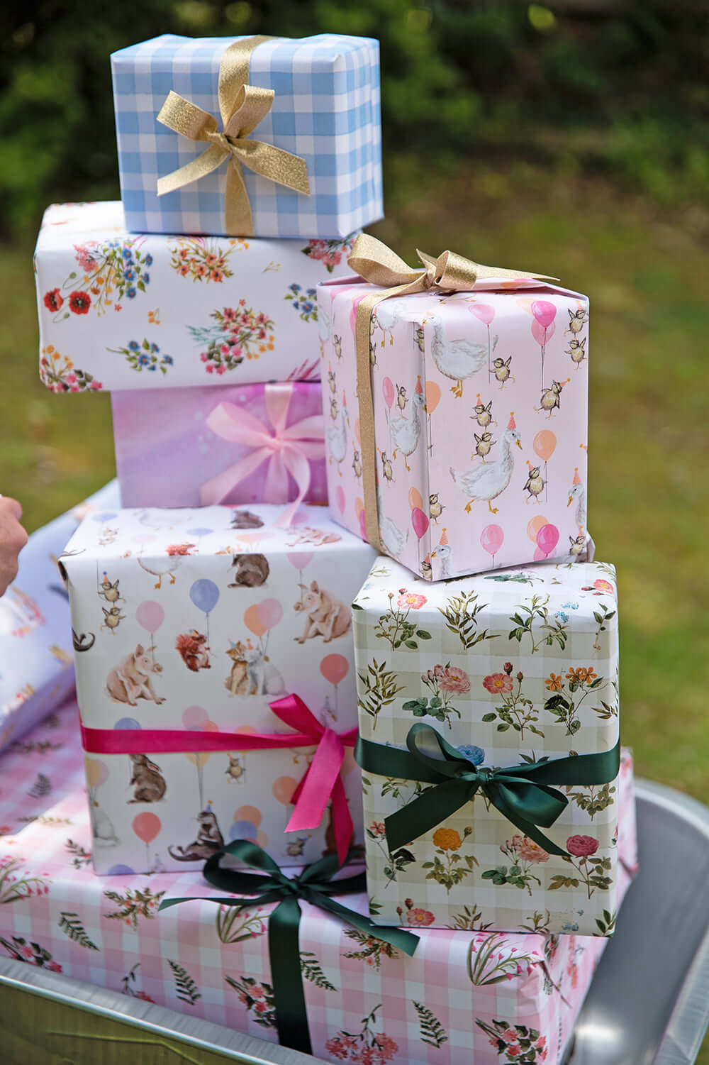 Colorful wrapped gifts featuring Making Meadows Wrapping Paper designs perfect for eco-conscious shoppers.