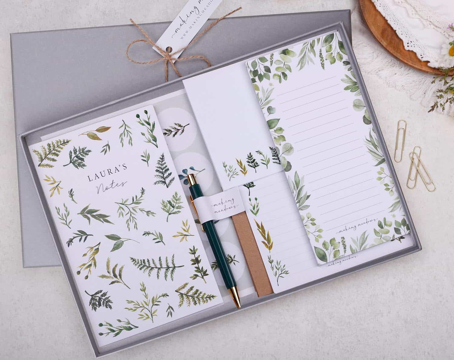 Stationery Gift Box featuring a luxury collection of eco-friendly stationery, notebooks, and pens with floral designs.