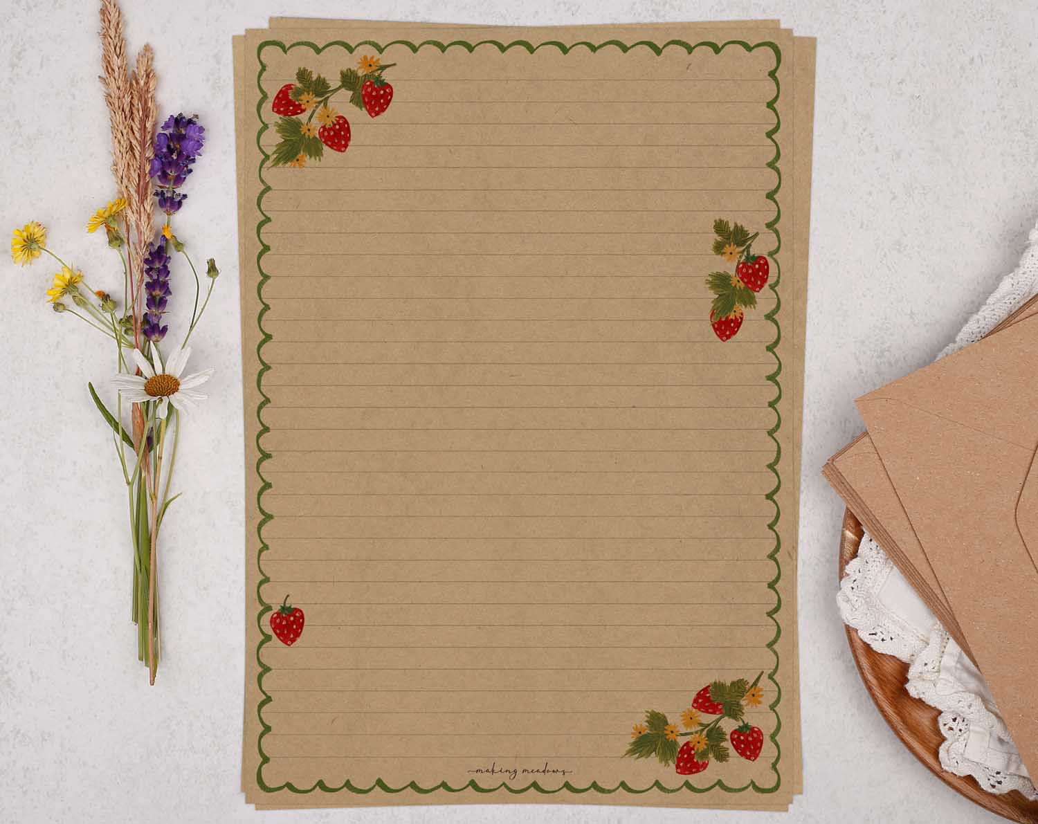 A4 kraft writing paper with a strawberry scalloped edge. Stationery designed by Making Meadows