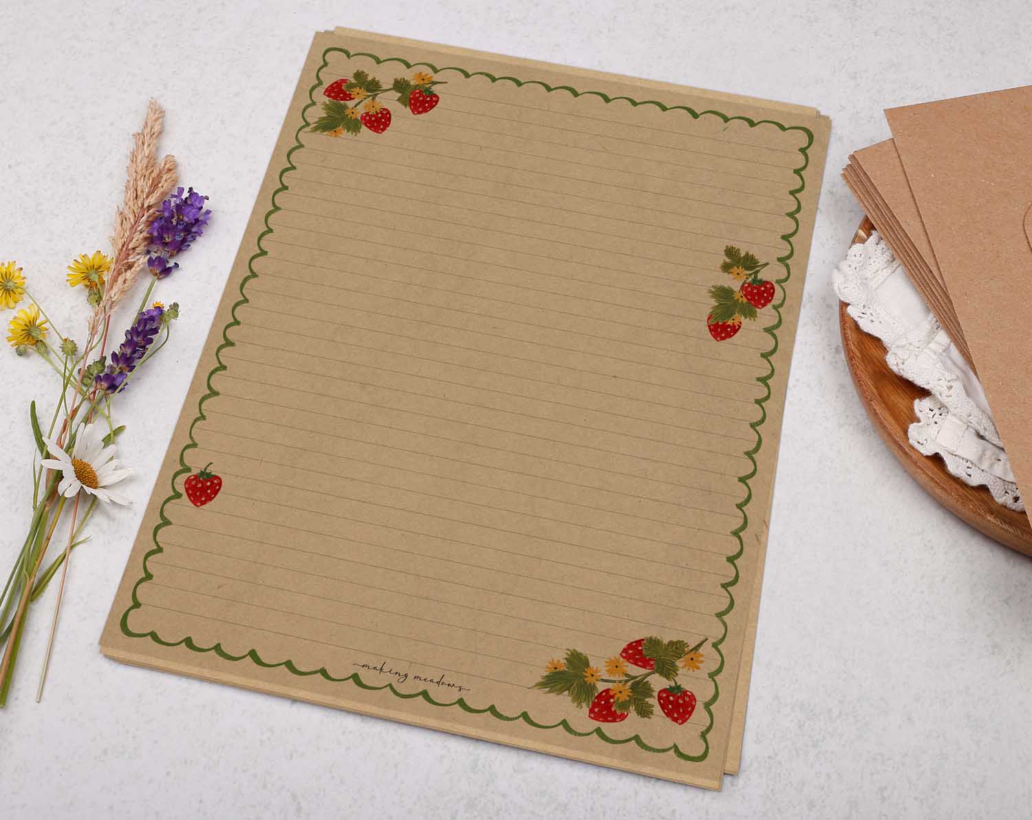 A4 kraft writing paper with a strawberry scalloped edge. Stationery designed by Making Meadows