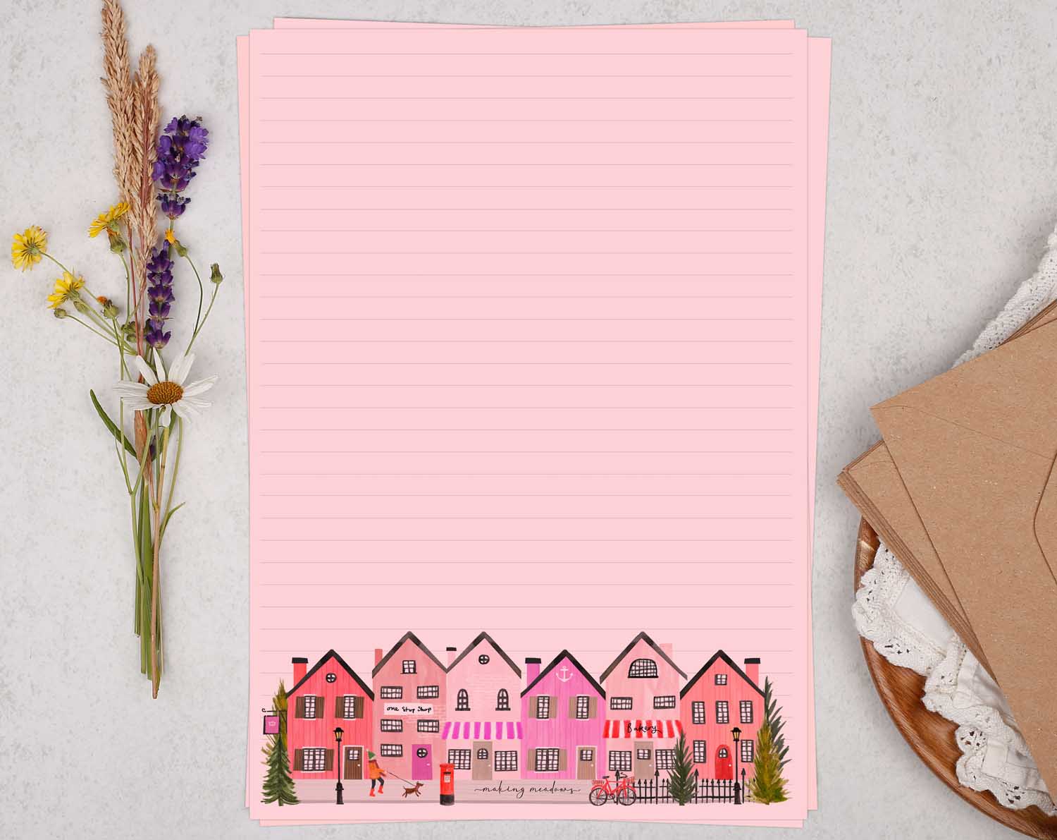 A4 pink writing paper with village shops. Stationery designed by Making Meadows