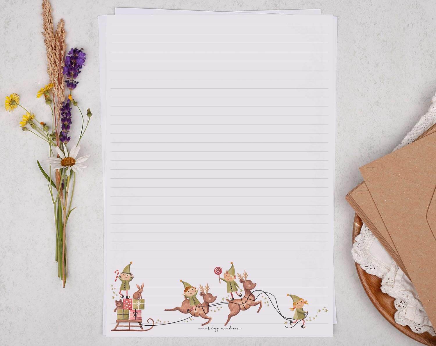 A4 writing paper with Christmas Elves on Reindeer. Stationery designed by Making Meadows