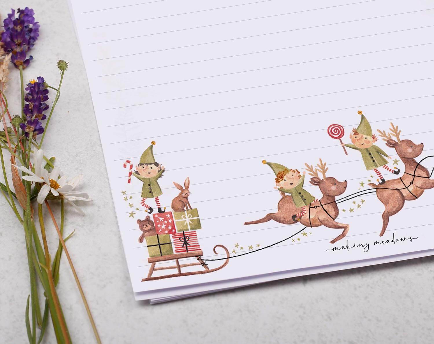 A4 writing paper with Christmas Elves on Reindeer. Stationery designed by Making Meadows