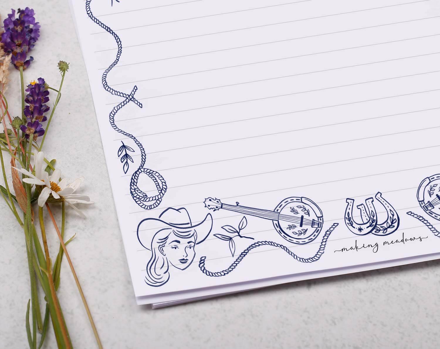 A4 writing paper with a blue cowboy border. Stationery designed by Making Meadows