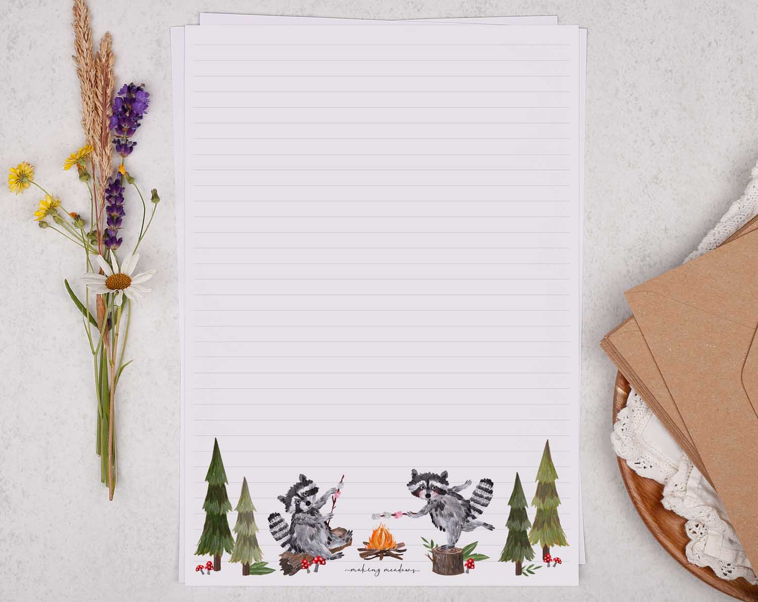 A4 writing paper with camping raccoons. Stationery designed by Making Meadows