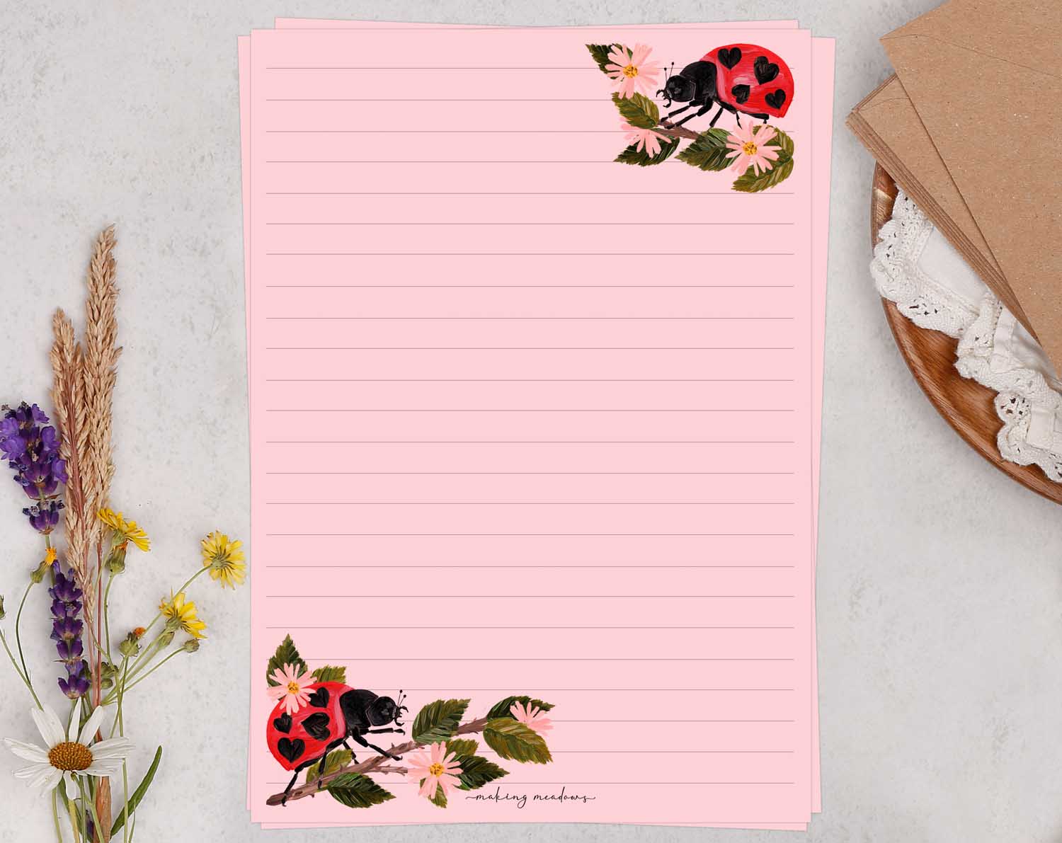 A5 pink writing paper with ladybird bugs. Stationery designed by Making Meadows