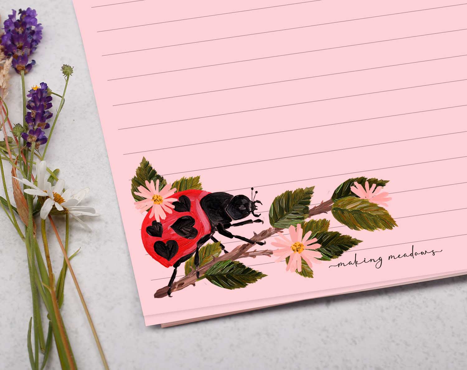 A5 pink writing paper with ladybird bugs. Stationery designed by Making Meadows