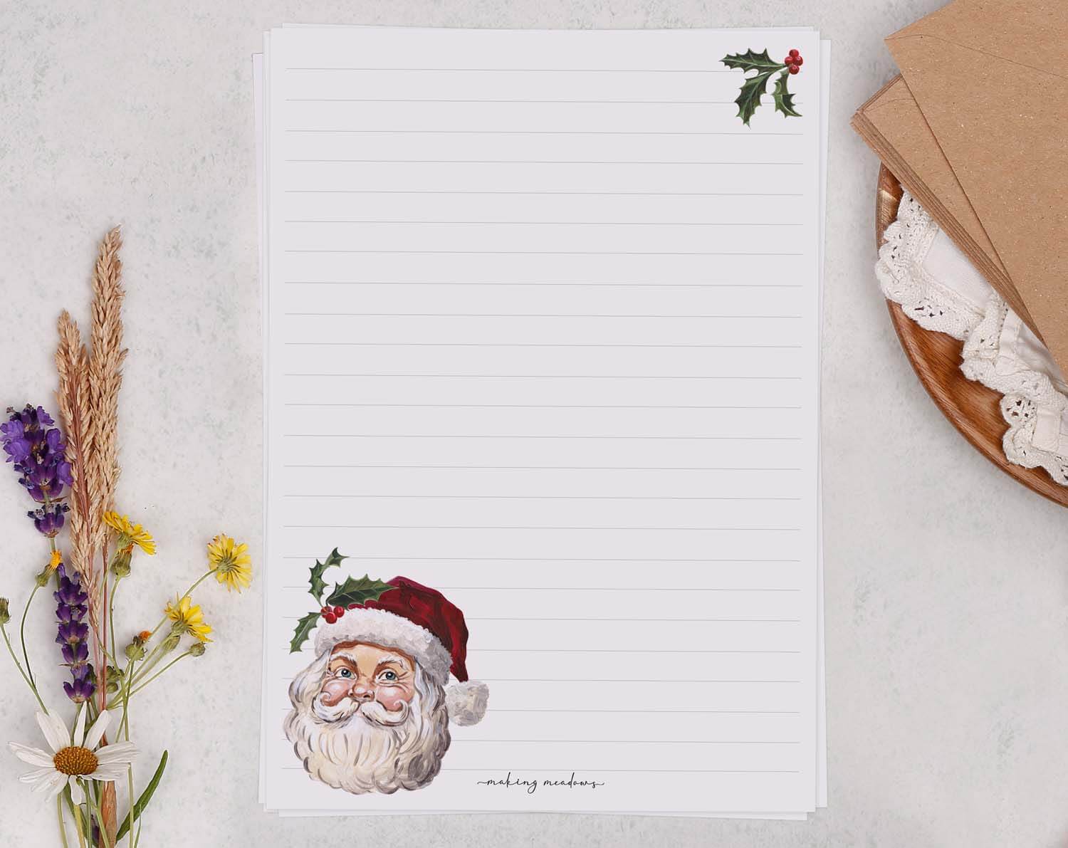 A5 writing paper with Father Christmas featuring a festive Santa illustration and decorative holly.