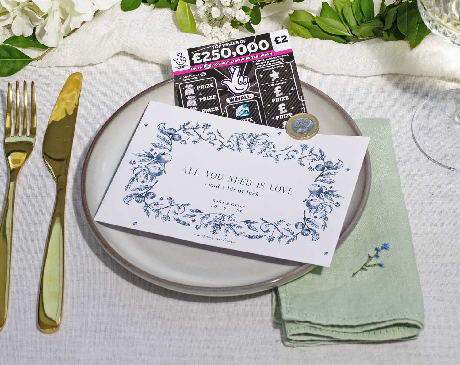 Blue Garden Scratch Card Envelopes on a wedding table setting with scratch card and decorative elements.