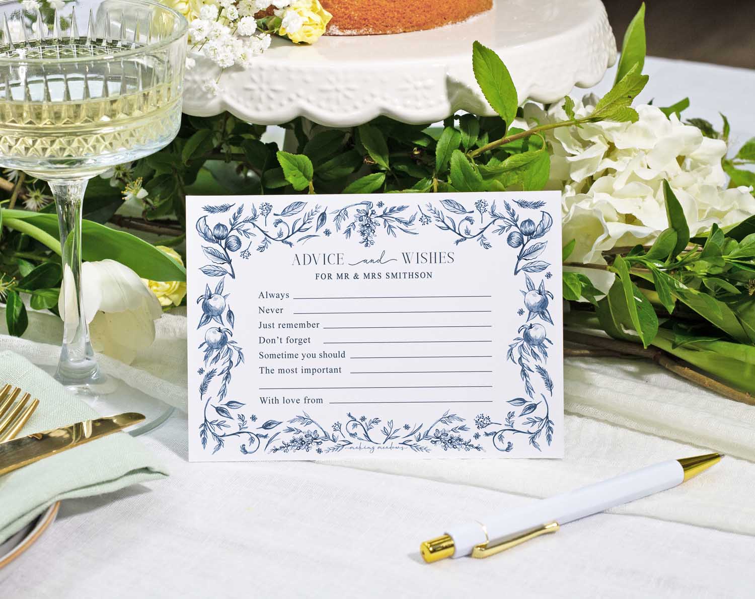 Blue Garden Wedding Advice Cards on a table with white flowers, inviting guests to share wishes and advice.