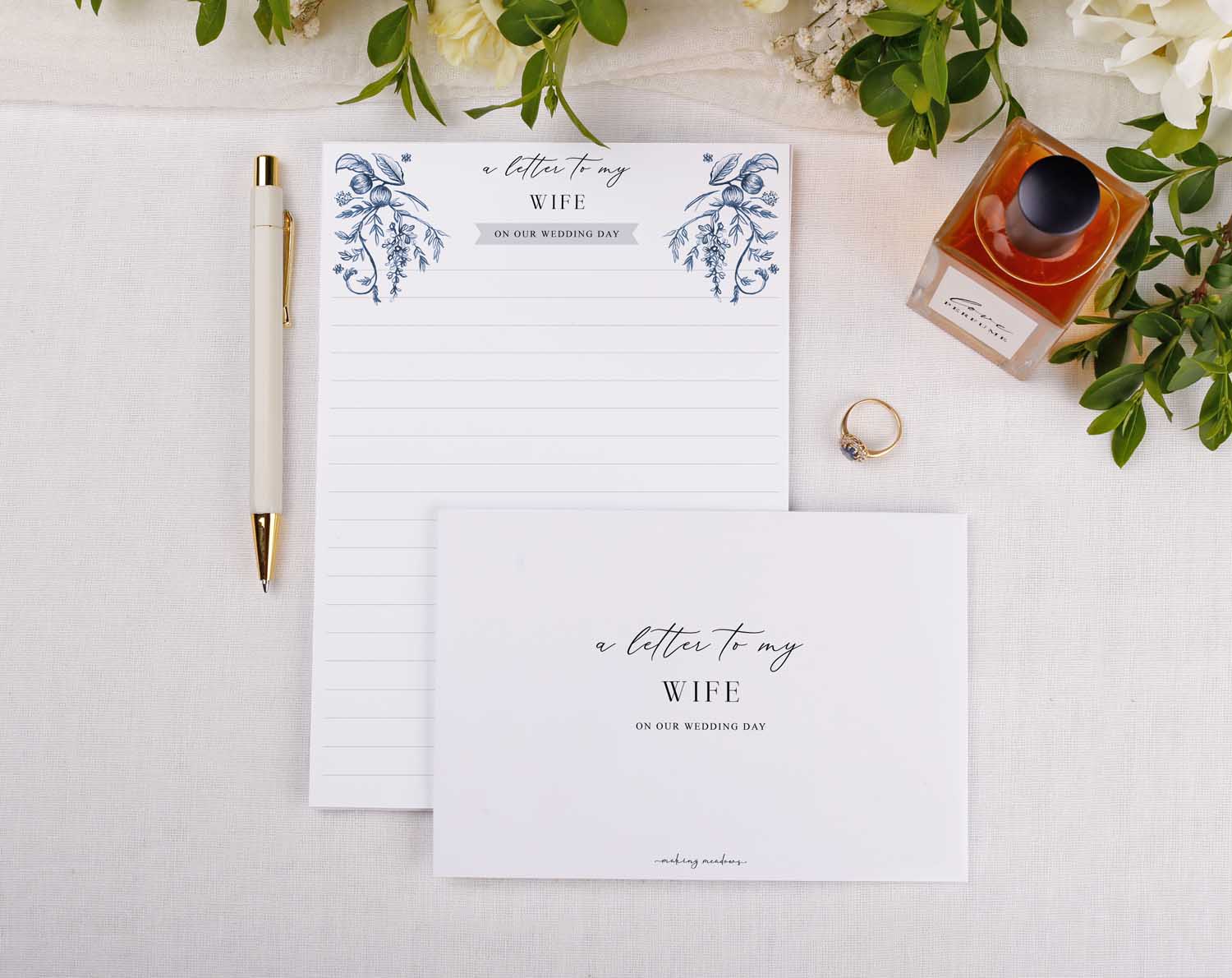 Blue Garden Wedding Letter to My Wife kit with writing paper, envelope, pen, and ring on a soft background.