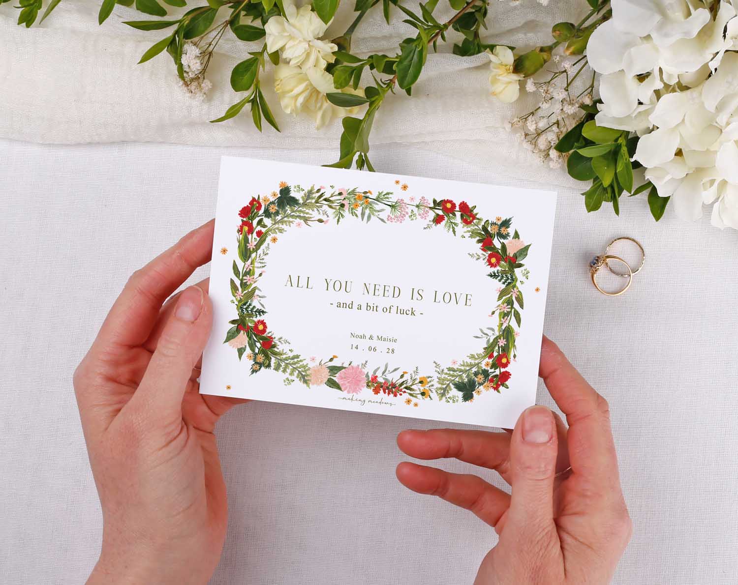 Boho Scratch Card Envelopes featuring the phrase 'All you need is love and a bit of luck' held in hands.