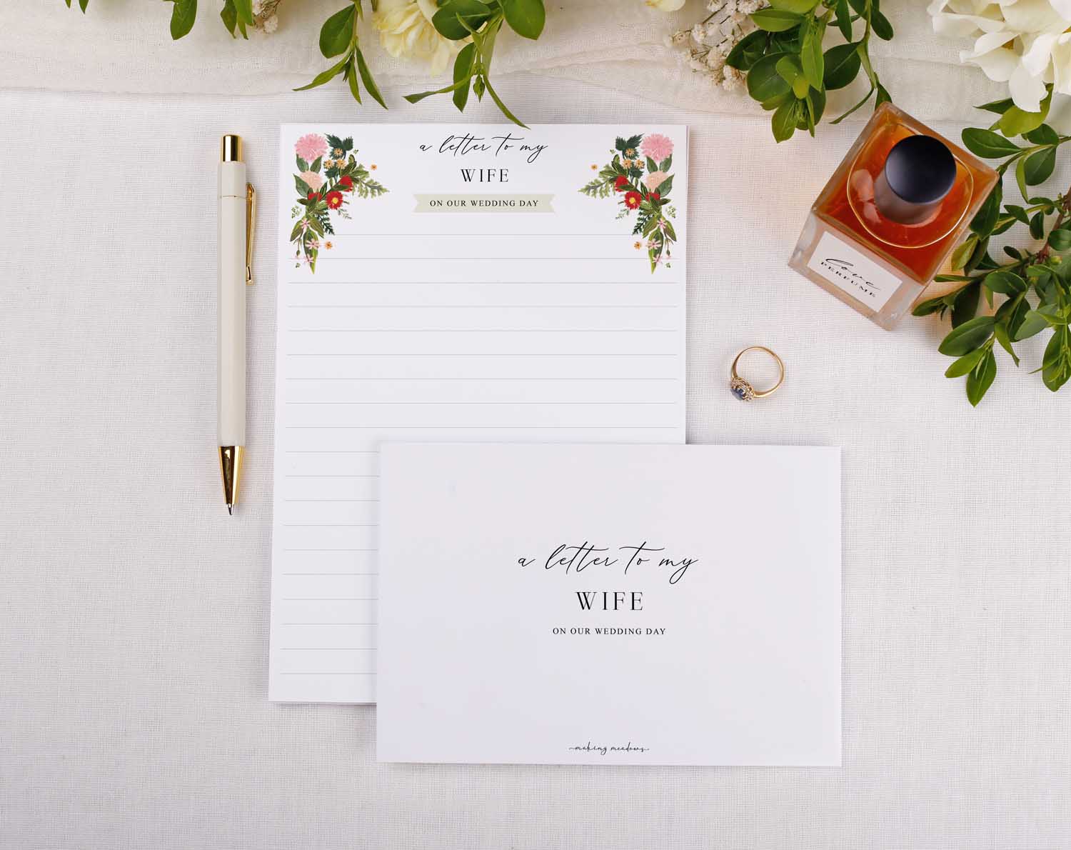 Boho Wedding Letter to My Wife stationery with floral design, pen, and wedding ring.