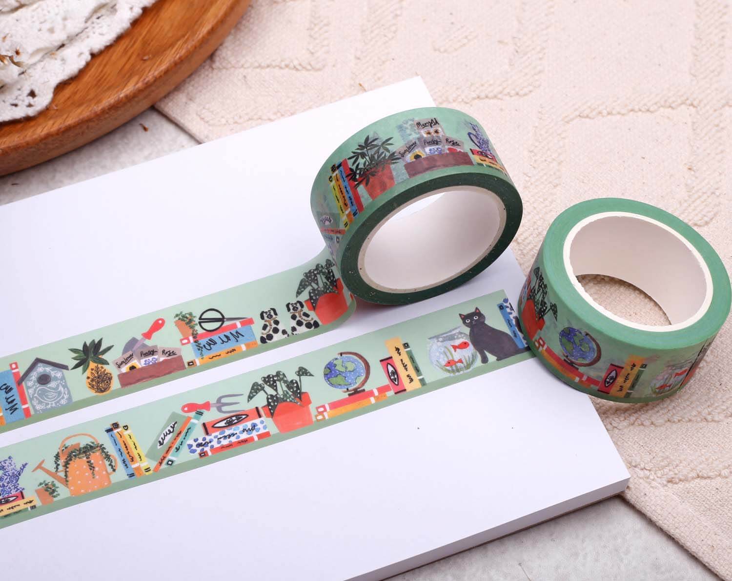 Book Washi Tape - Eco Paper Roll featuring literary motifs on decorative rolls with a green base design.
