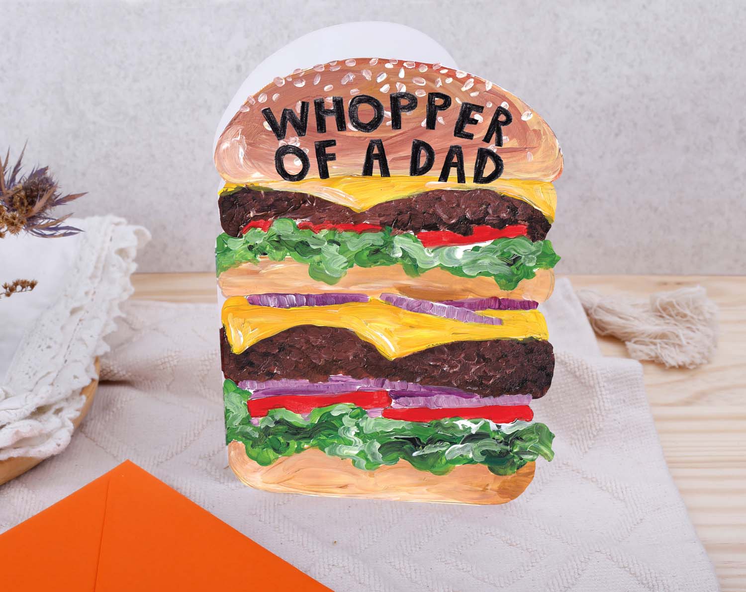 Card designed like a burger with 'Whopper of a Dad' text on a light background