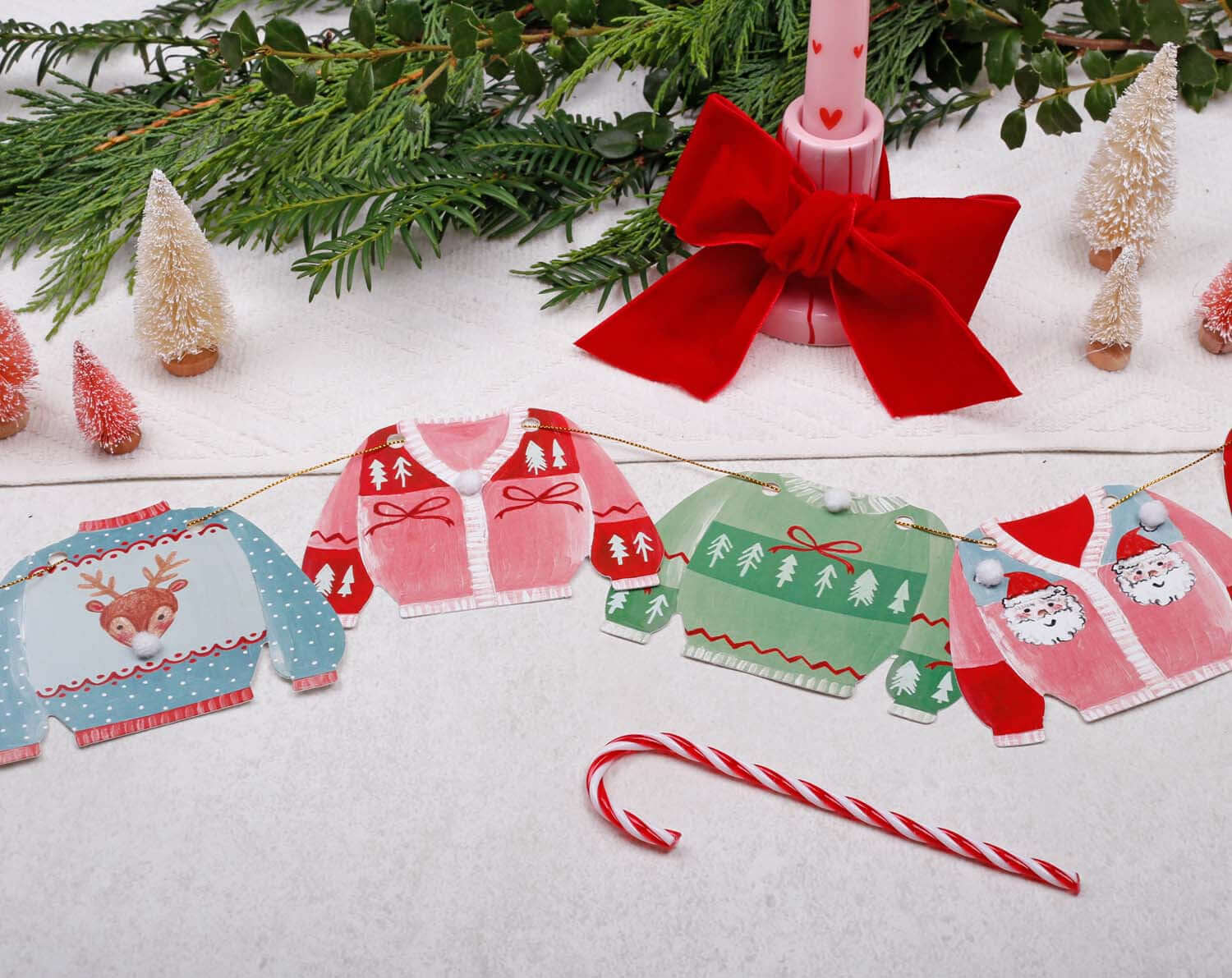 Jumper Christmas Bunting showcasing colorful festive jumper flags with holiday designs for decoration.