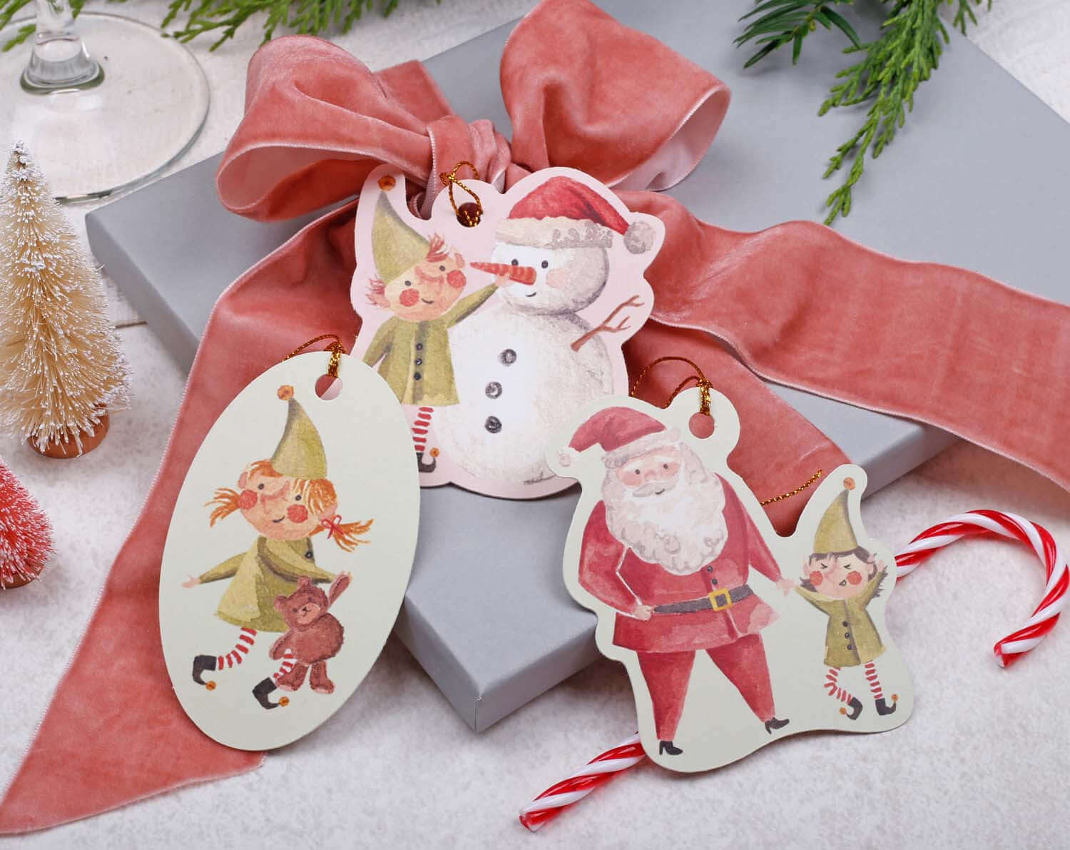 Elf Christmas Gift Tags featuring cute elf and Santa illustrations for festive gift wrapping.