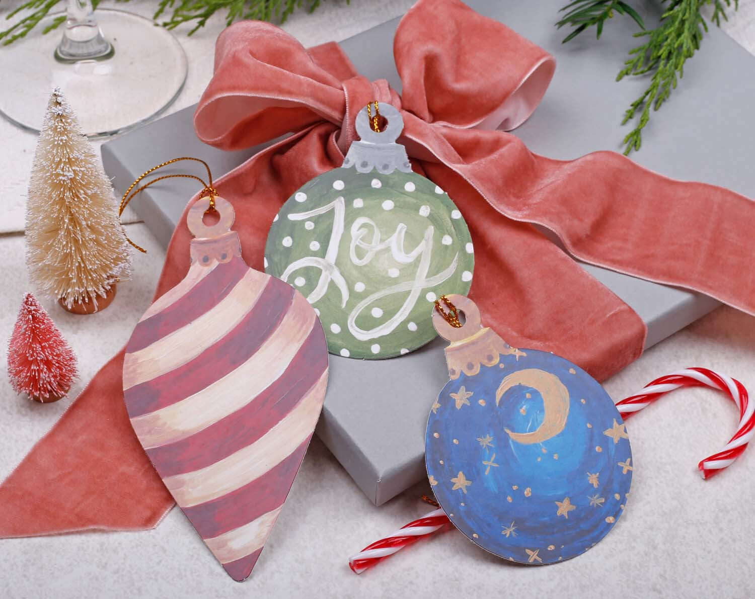 Bauble Christmas Gift Tags - 12 Pack featuring colorful ornament designs with festive motifs for Christmas gifts.