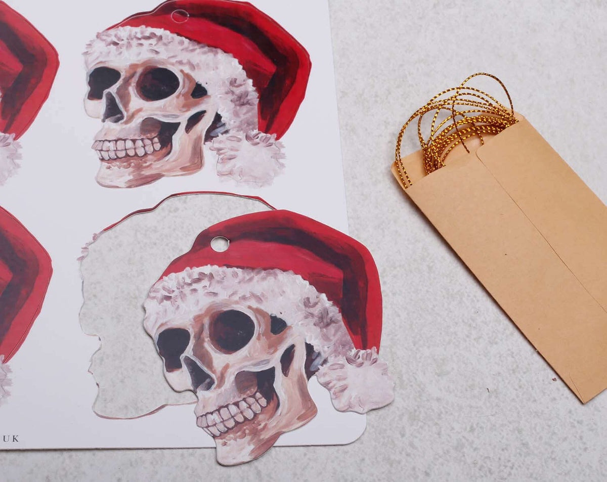 Gothic Skull Christmas Gift Tags with Santa hats, perfect for unique Nutcracker Christmas Gift Tags, 12 pack shown.