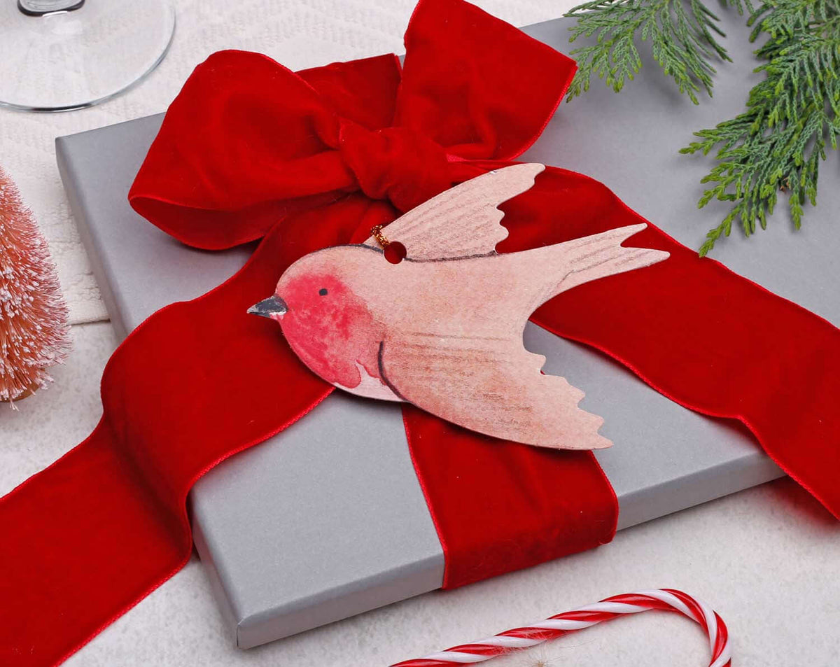 Robin Christmas Gift Tags on a beautifully wrapped grey gift with a red bow, perfect for holiday presents.