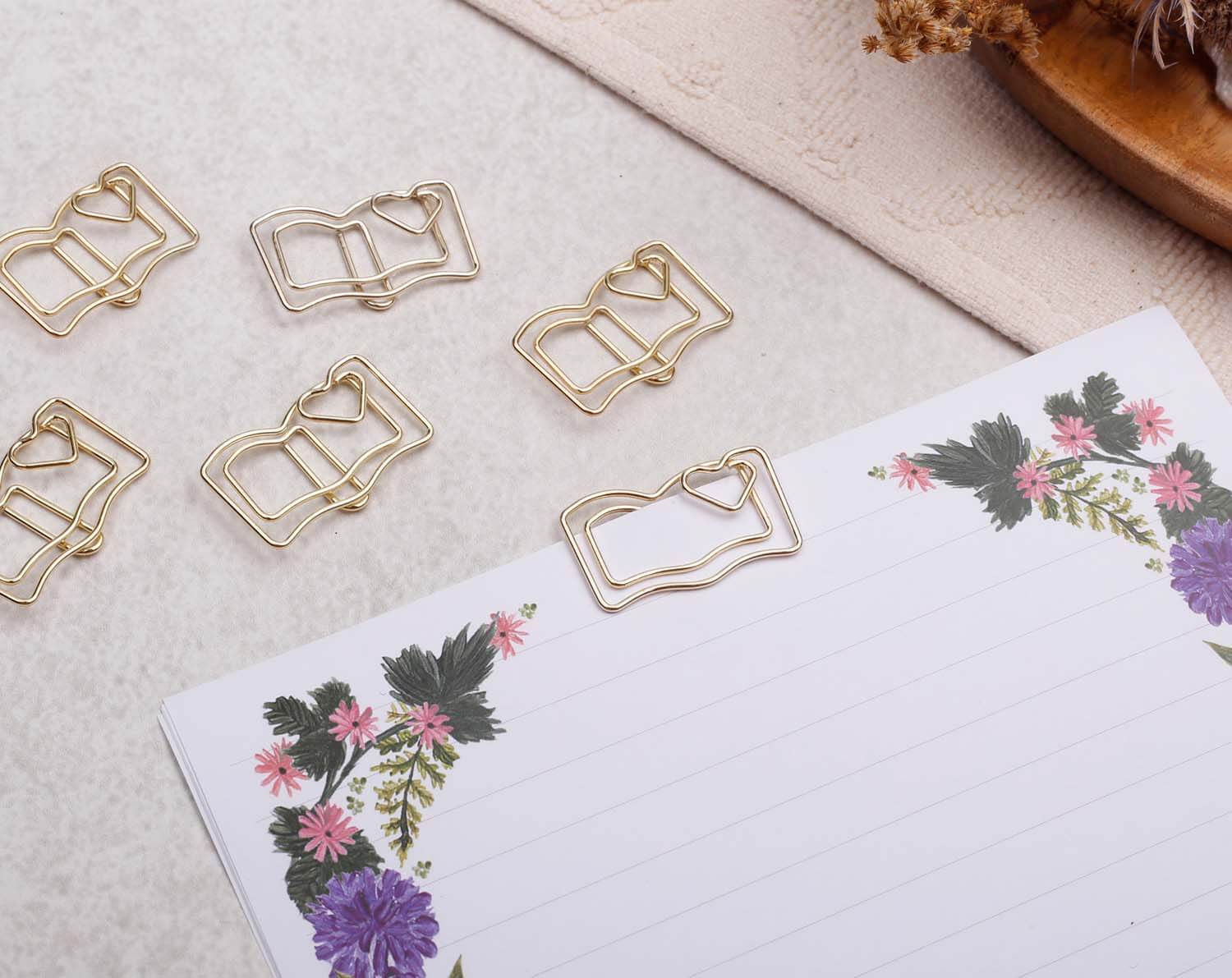 Gold Book Paper Clips in charming book shape, perfect for organizing notes and celebrating reading.