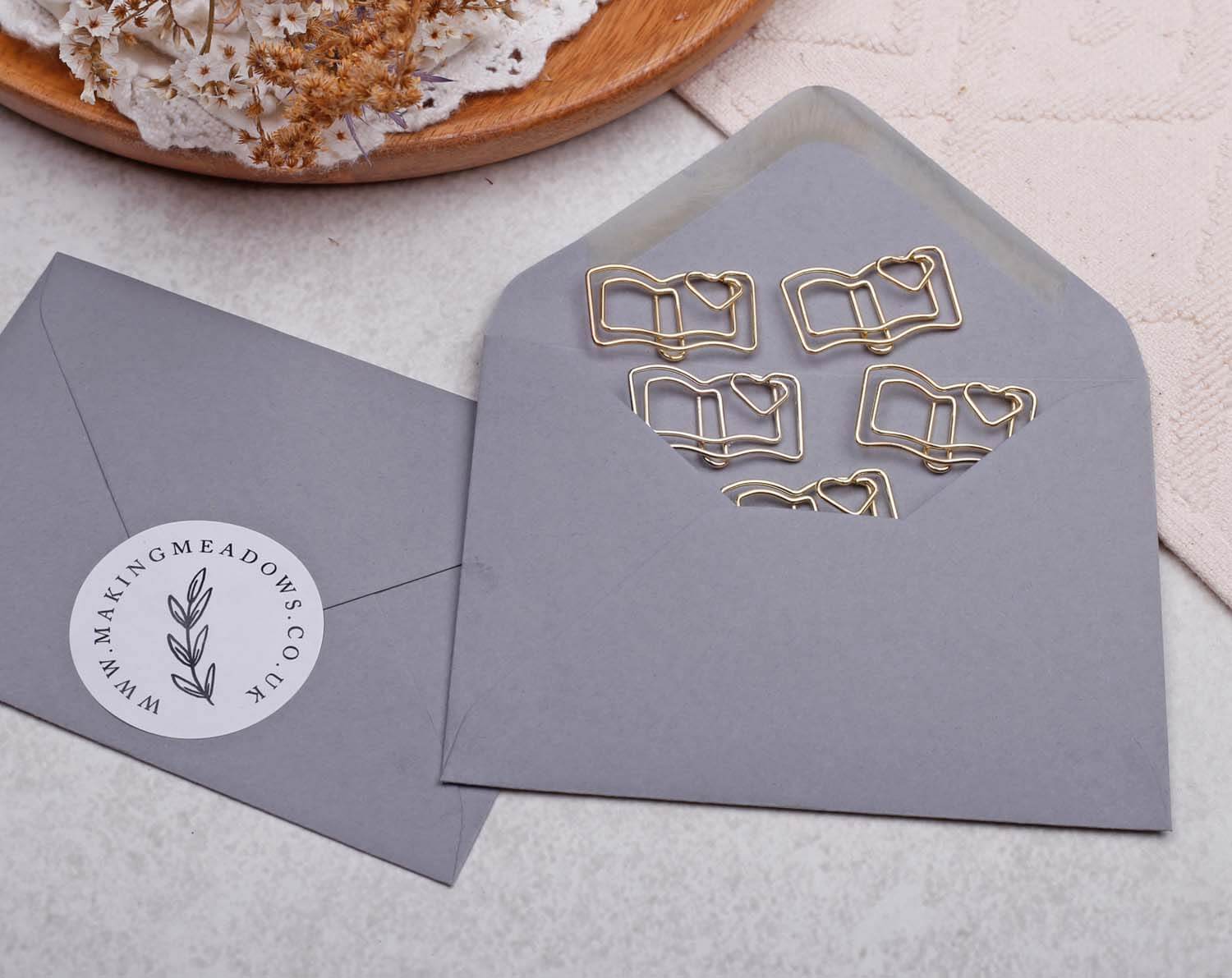 Gold Book Paper Clips in a grey envelope, perfect for book lovers and unique stationery.