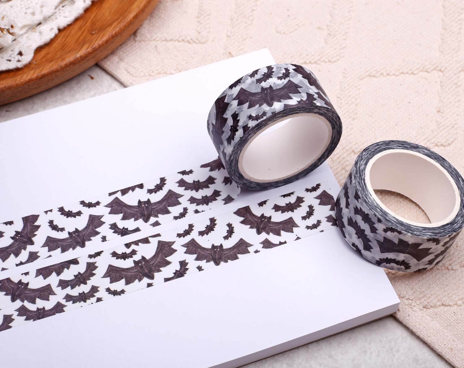 Gothic Bat Washi Tape displayed on a notepad with rolls ready for crafting and decoration.