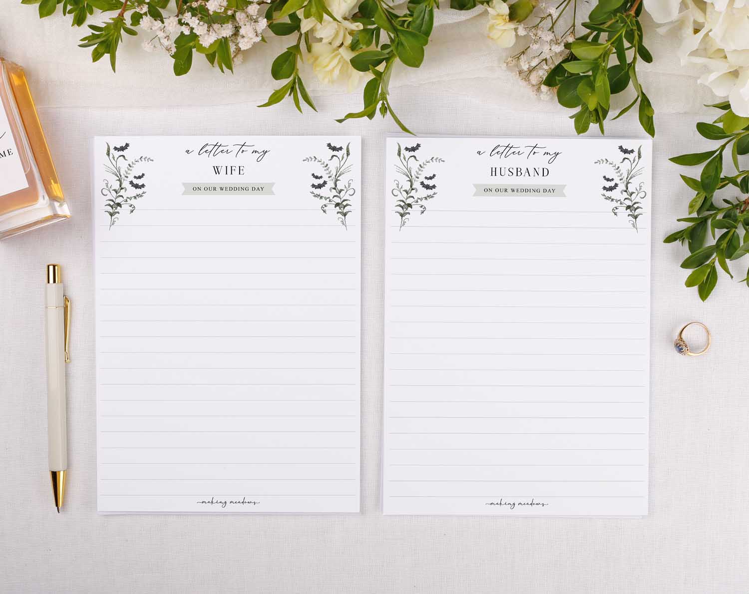 Gothic Wedding Letter to My Wife and Husband note cards on a wedding table with floral decorations.