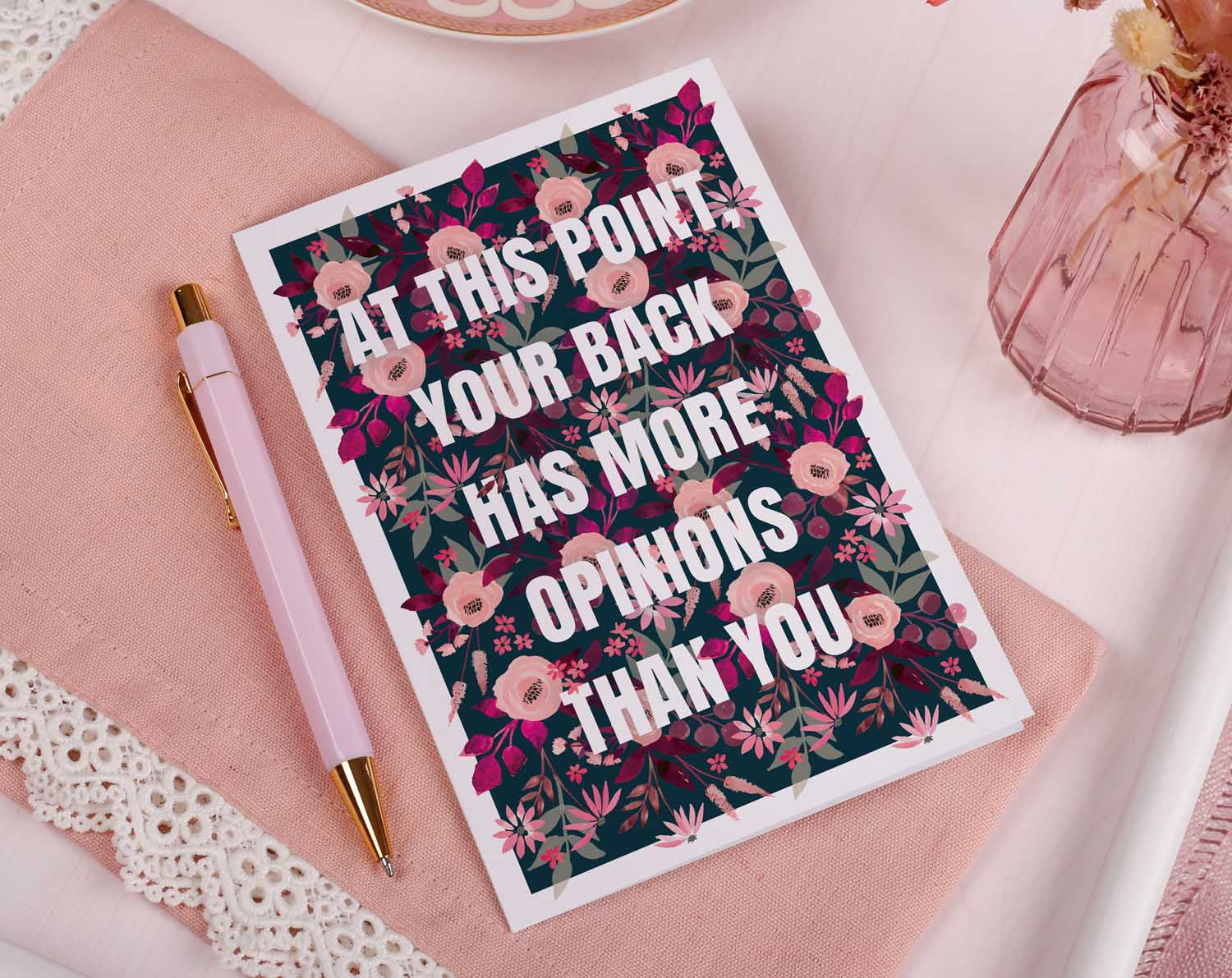 Bad Back Joke Birthday Card featuring floral background and humorous text about backs and birthdays.