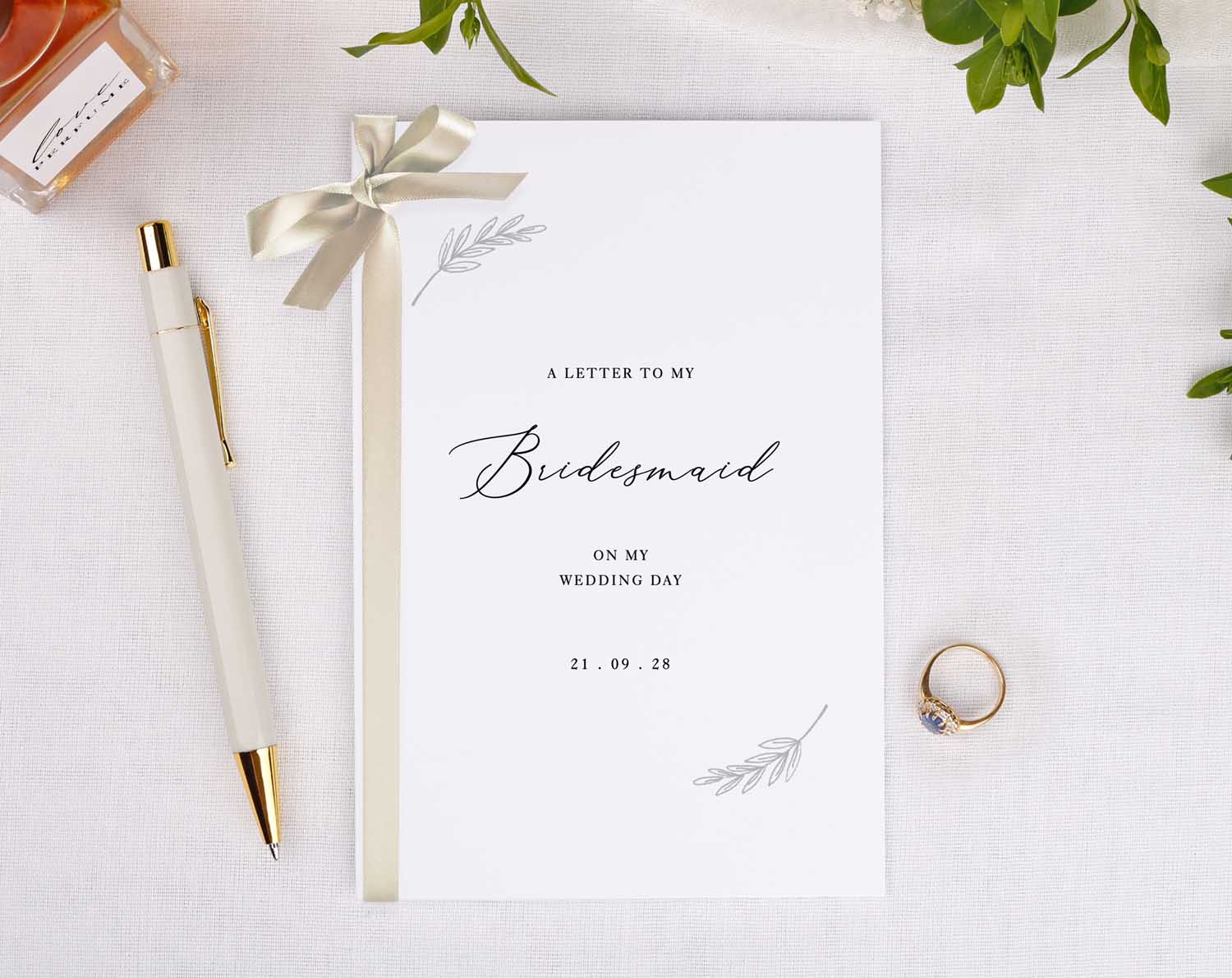 Minimalist Wedding Thank You Card featuring elegant design for bridesmaids with a pen and ring on a table.