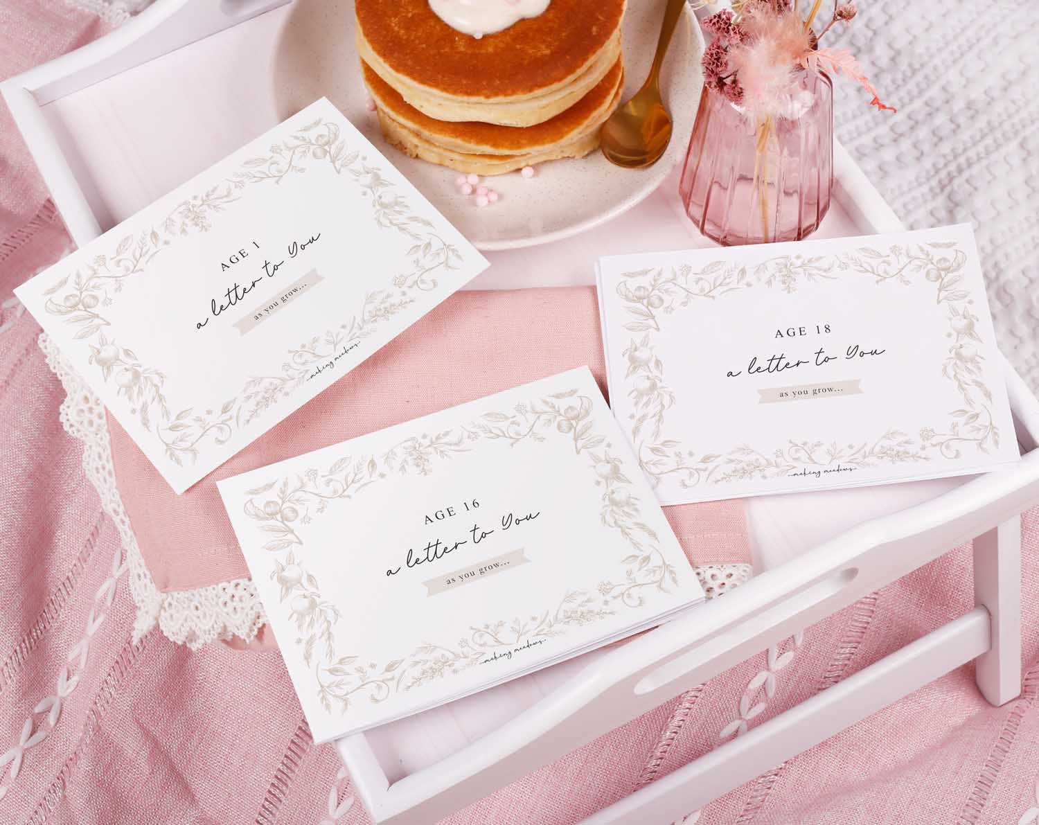 Personalised Neutral Letter To Our Son displayed on a tray with pancakes and a vase, showcasing a heartfelt keepsake.