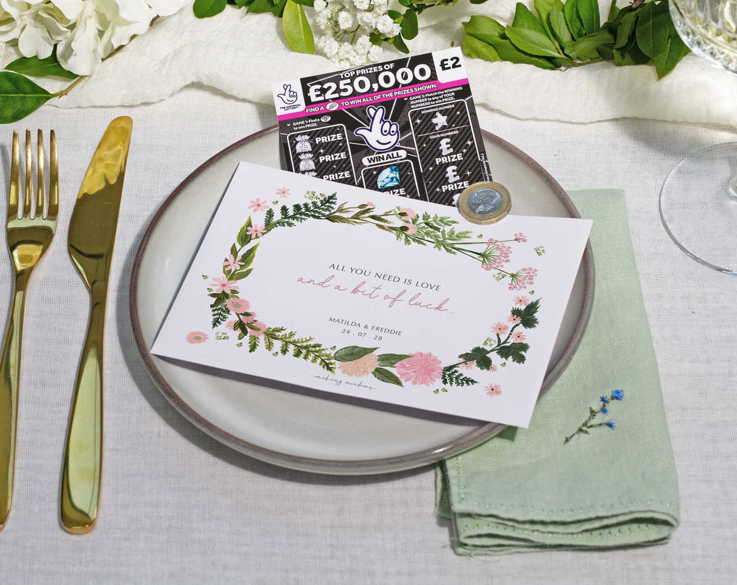 Pink Floral Scratch Card Envelopes with scratch card on a wedding table setting for favours and place settings.