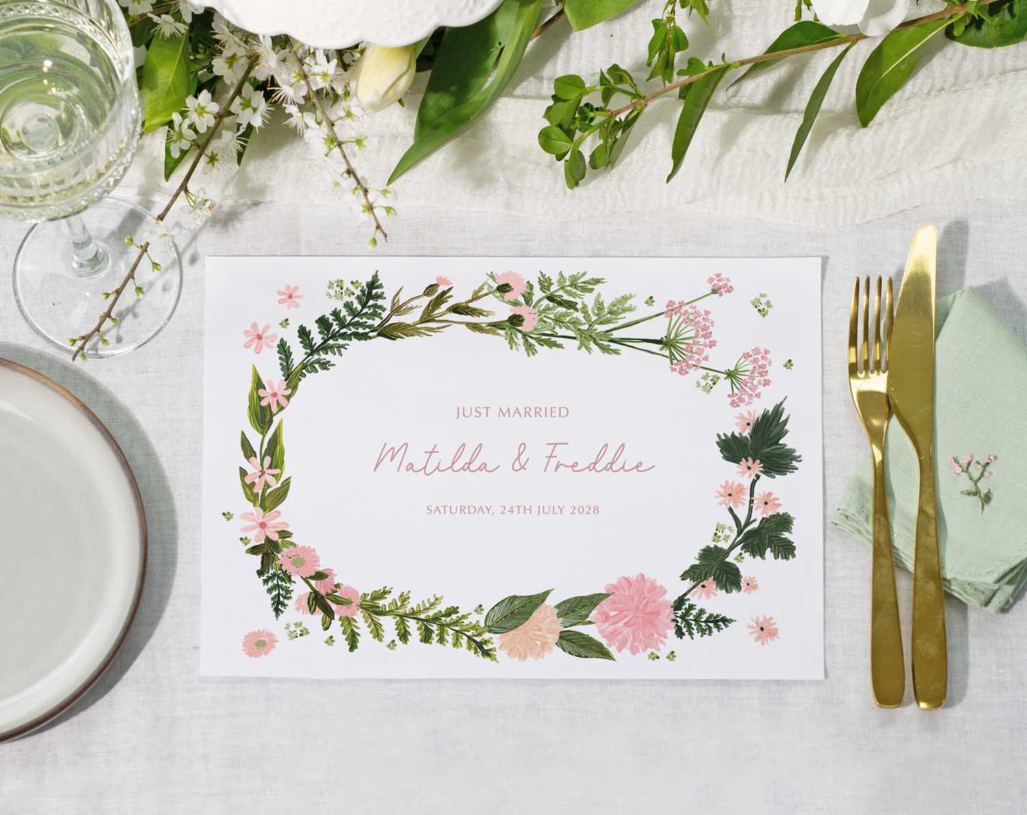 Pink Floral Wedding Placemats beautifully styled on a table with elegant tableware and floral decorations.