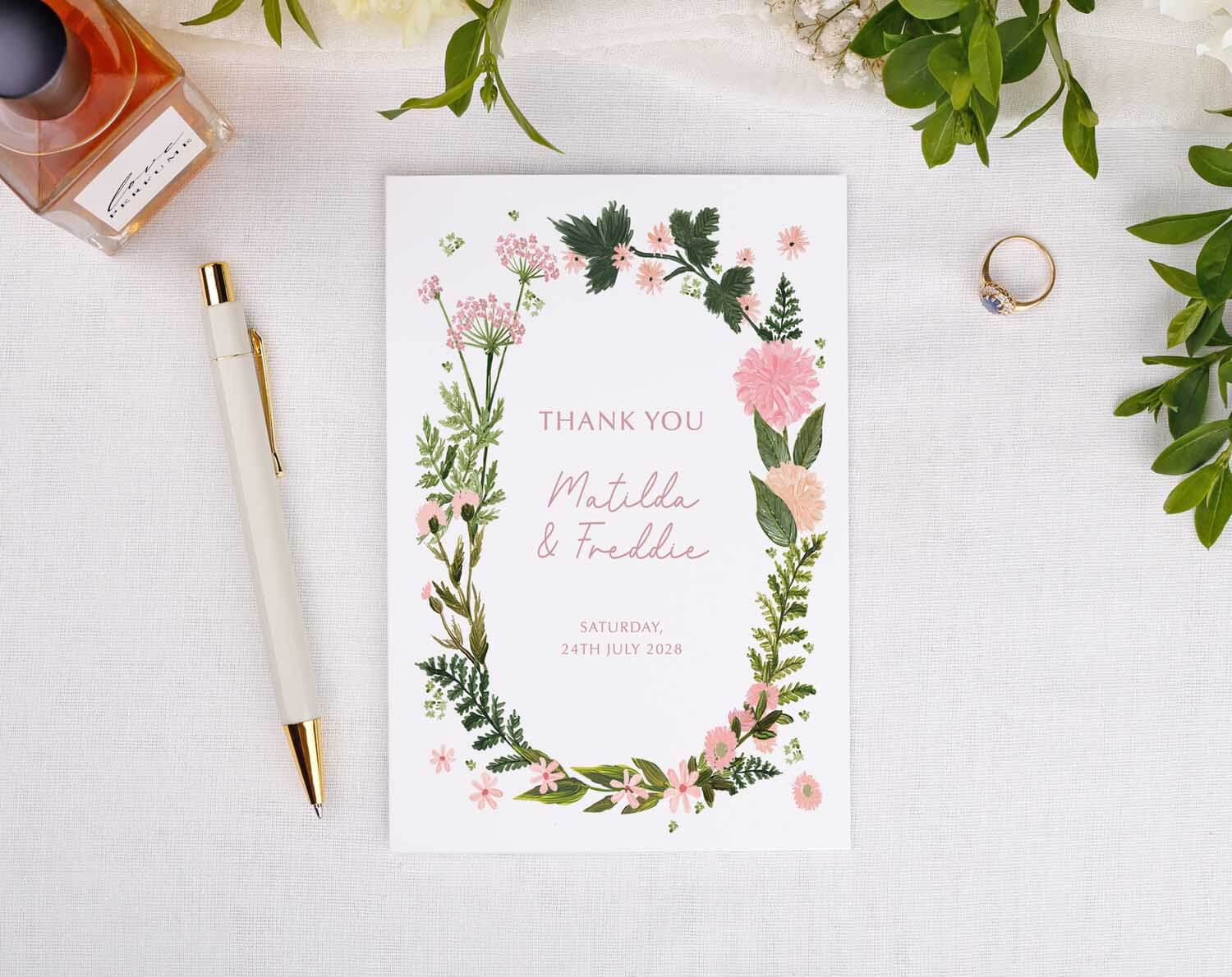 Pink Floral Wedding Thank You Cards featuring a floral design with personalized names and date.