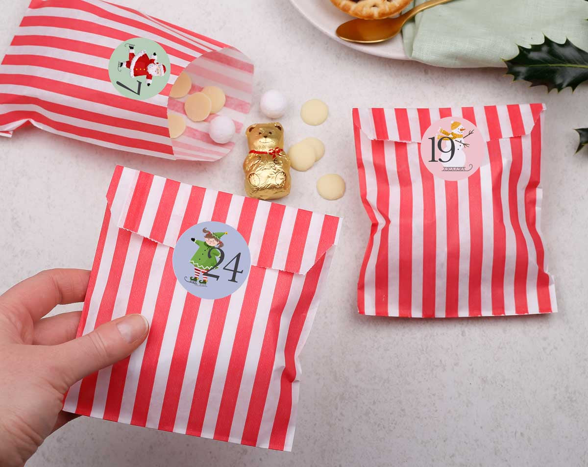 Santa Christmas Advent Calendar With Red Bags. Advent Calendars designed by Making Meadows