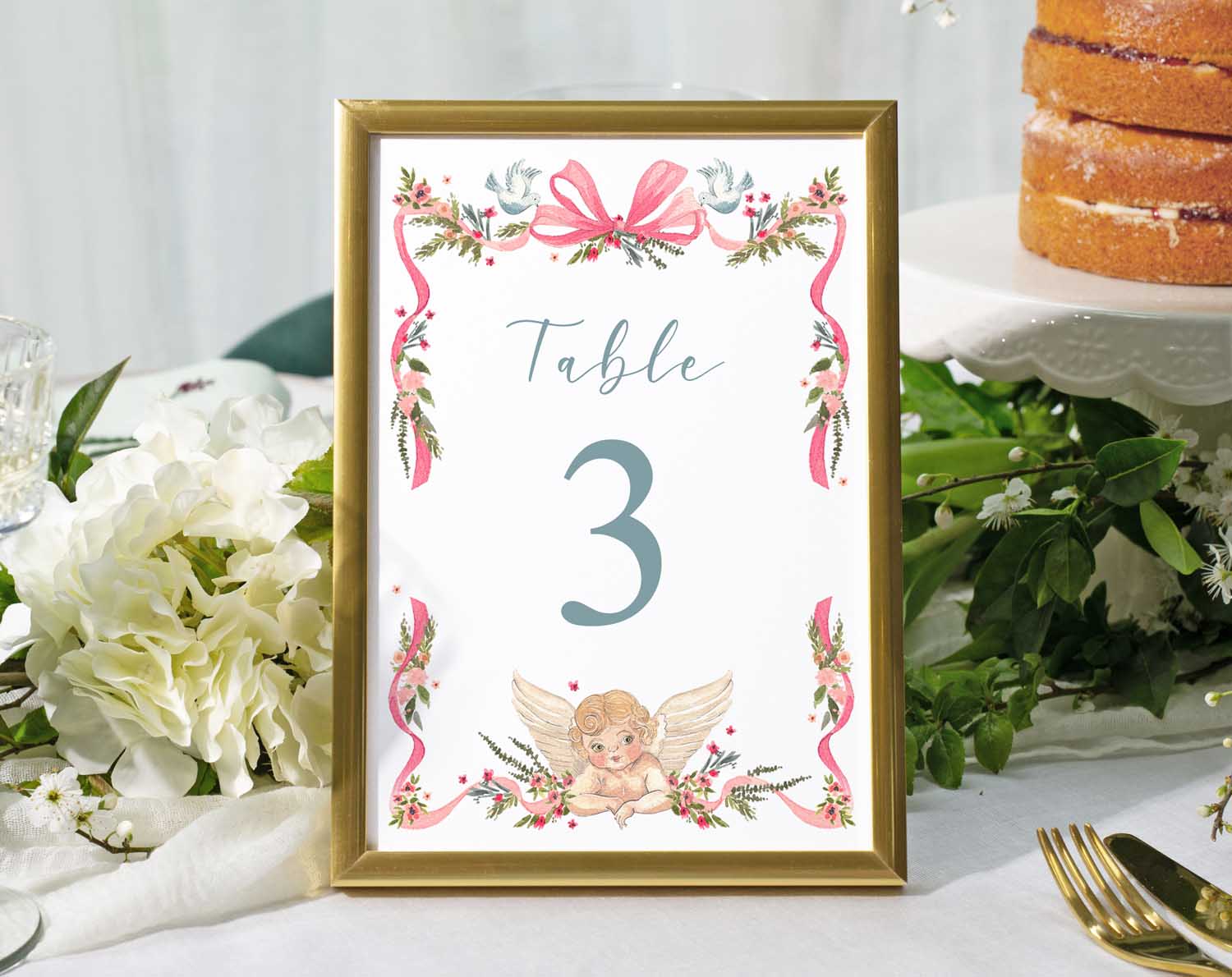 Vintage Wedding Table Numbers displayed in an elegant frame on a beautifully set reception table.