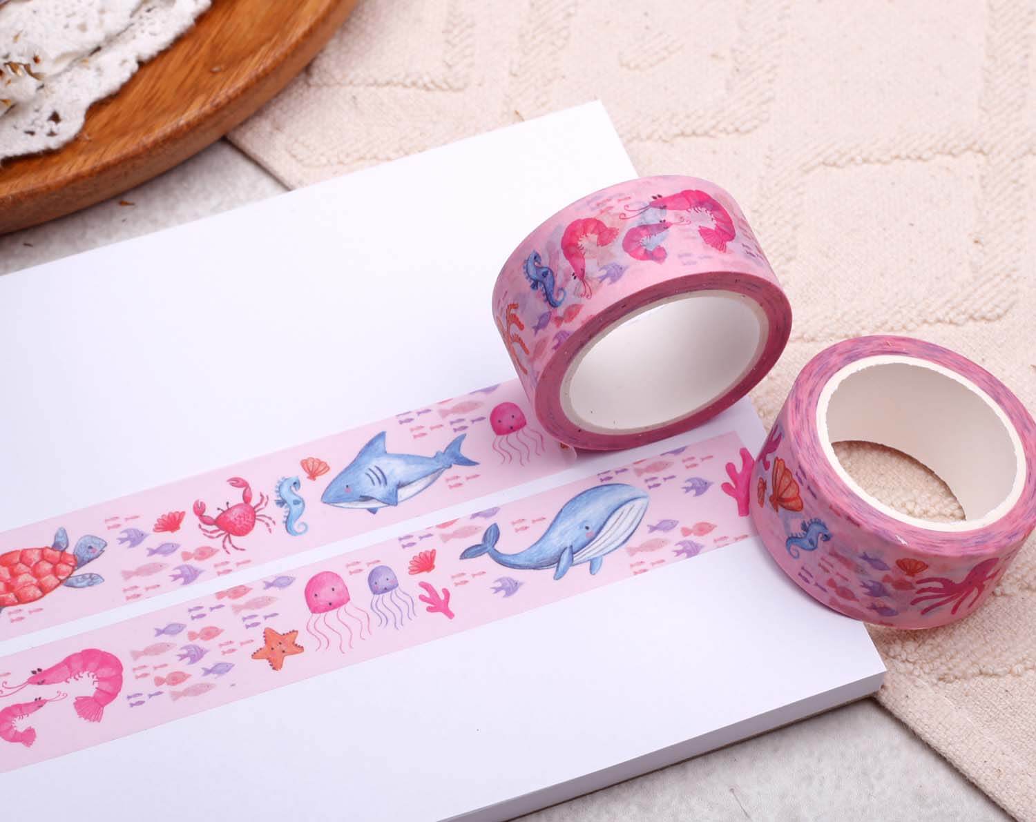 Under The Sea Washi Tape showcasing ocean creatures and vibrant designs on a pink background.