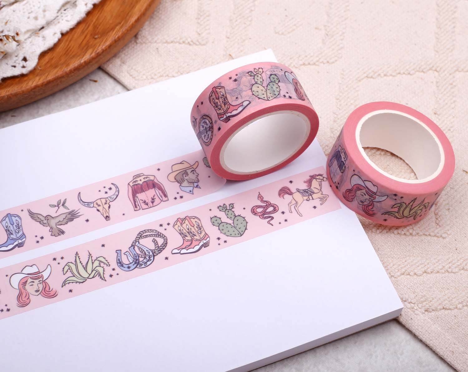 Pink Cowgirl Washi Tape rolls displayed on white paper with colorful cowgirl designs.