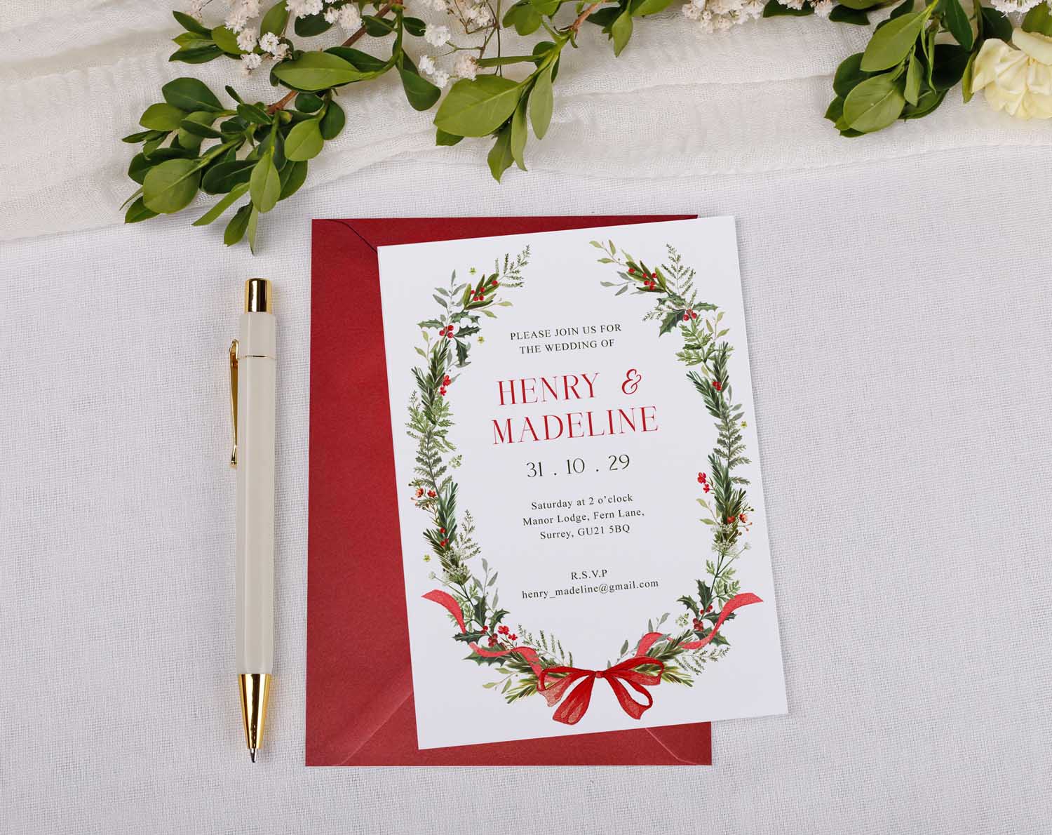 Winter Wedding Invitations featuring a personalised design with festive greenery, red bow, and elegant text for couples.