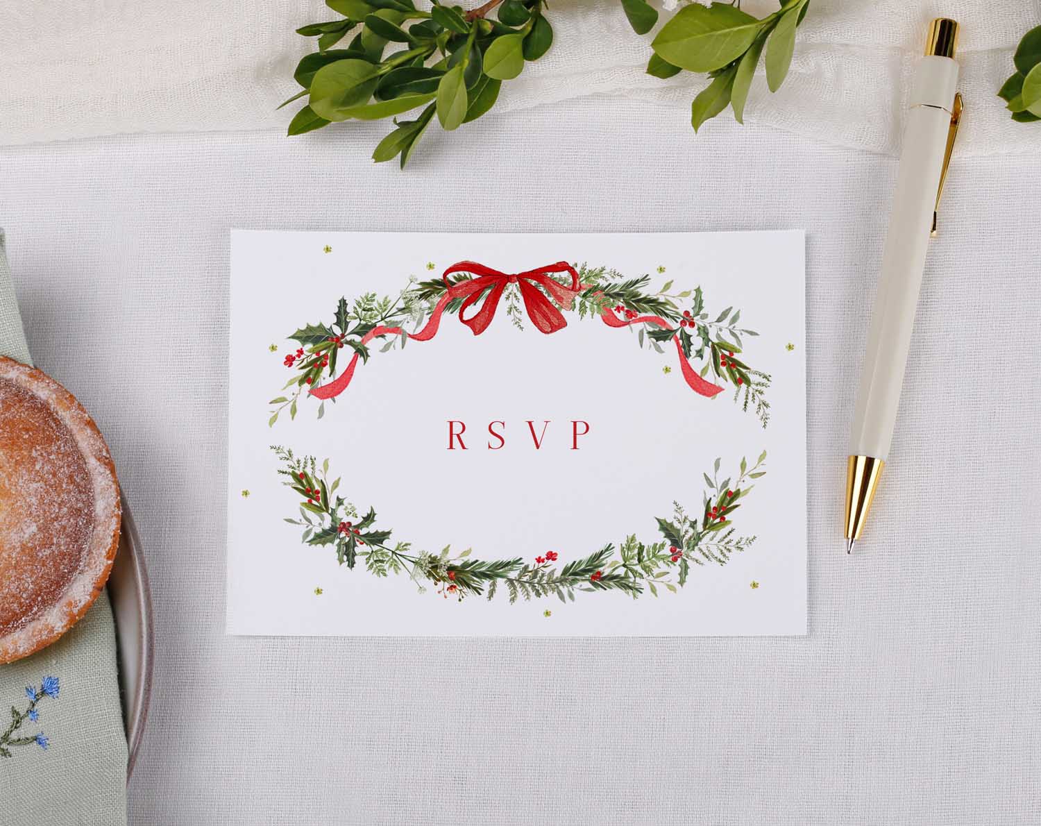 Winter Wedding RSVP Cards featuring a decorative floral wreath and a red bow, perfect for elegant wedding invitations.