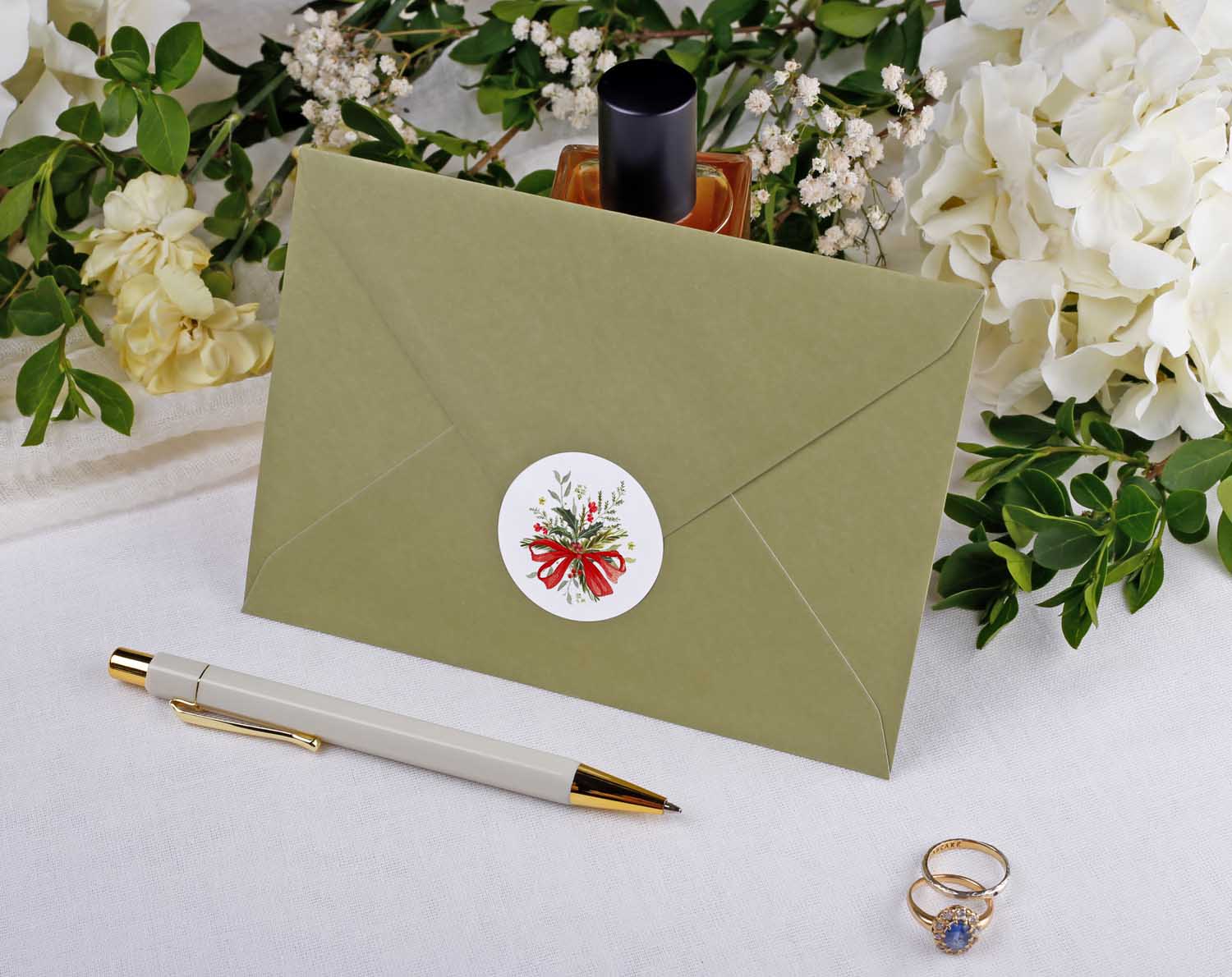 Winter Wedding Stickers decorating an envelope seal with festive design for wedding stationery.