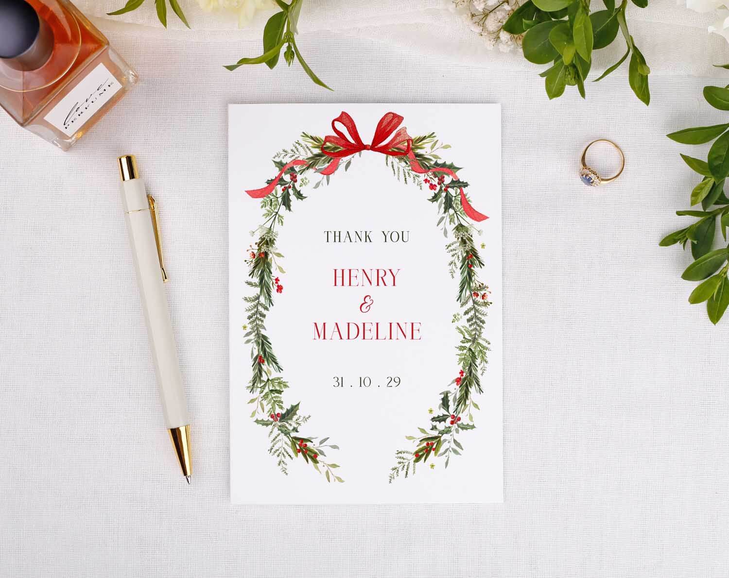 Winter Wedding Thank You Cards featuring a floral design with names Henry and Madeline and a festive bow.