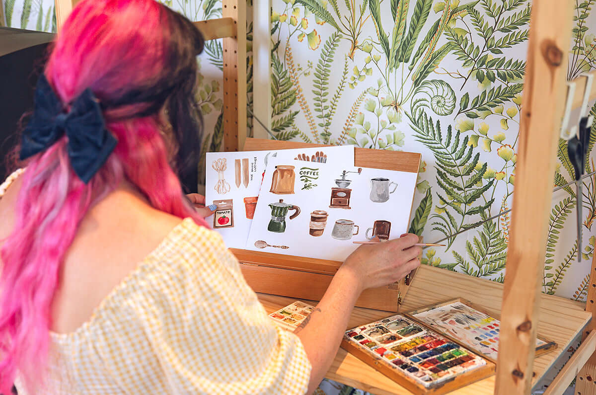 Samantha painting her making meadow designs for small batch stationery