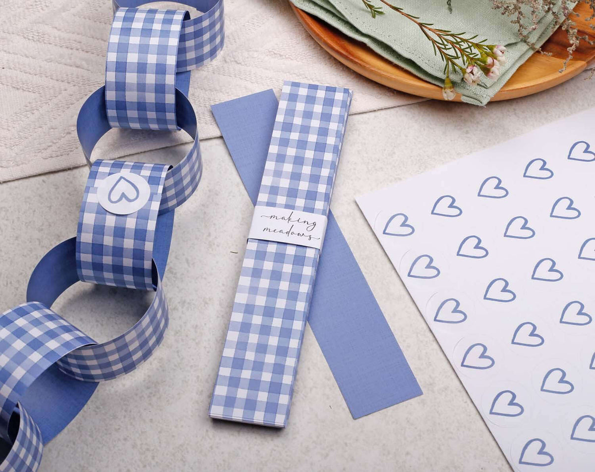 Blue Gingham Paper Chains displayed with heart-patterned paper and decorative napkins.