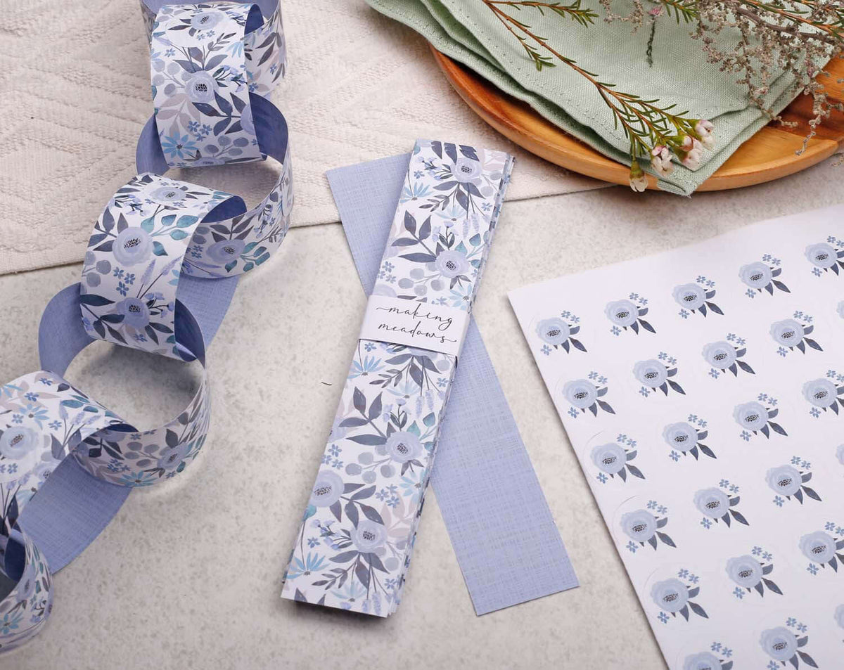 Blue Floral Paper Chains displayed with matching paper and decorative elements for crafting and decorations.
