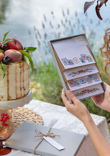 girl holding letter writing paper gift box set with floral design