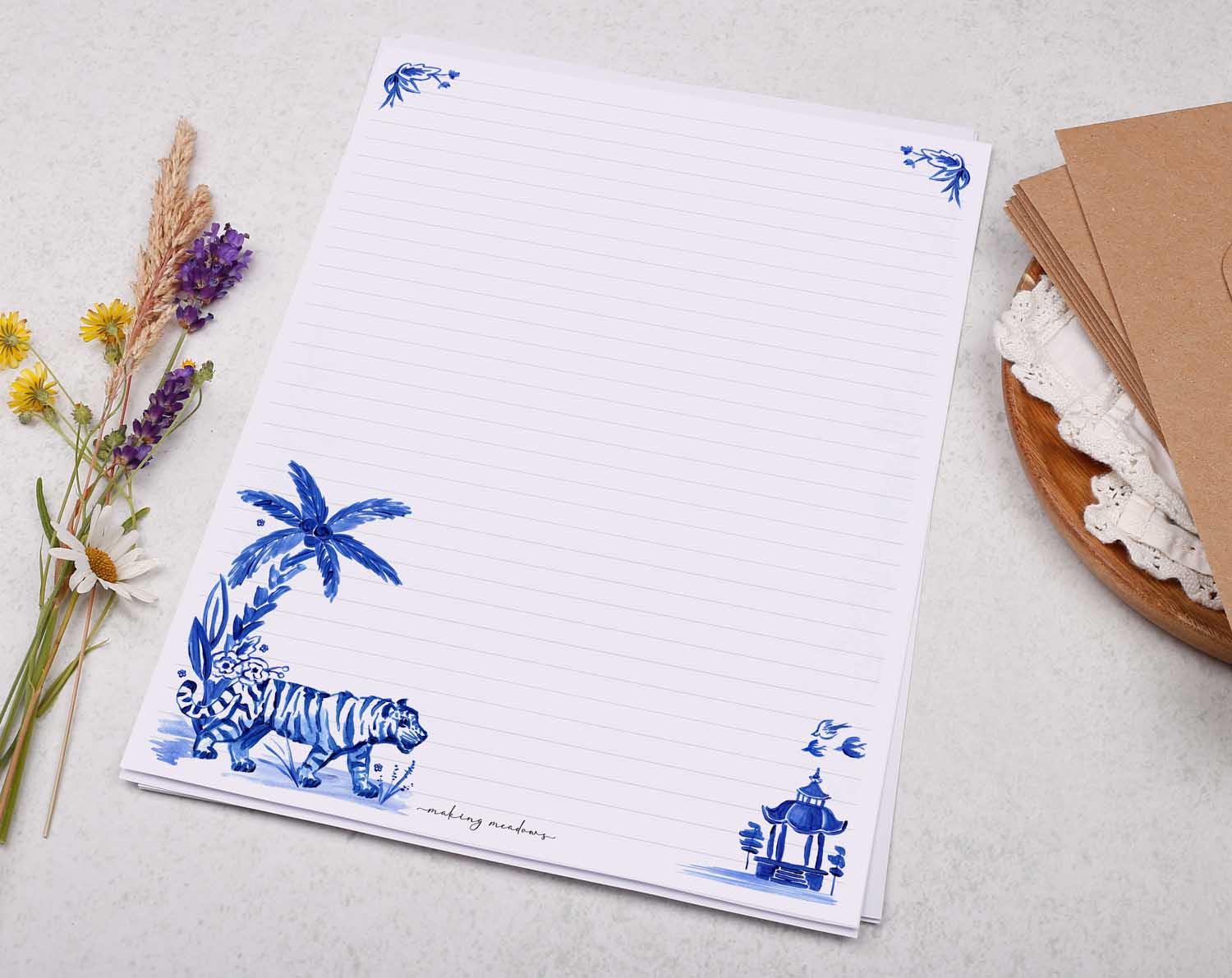 A4 writing paper with a blue tiger and palm tree. Stationery designed by Making Meadows