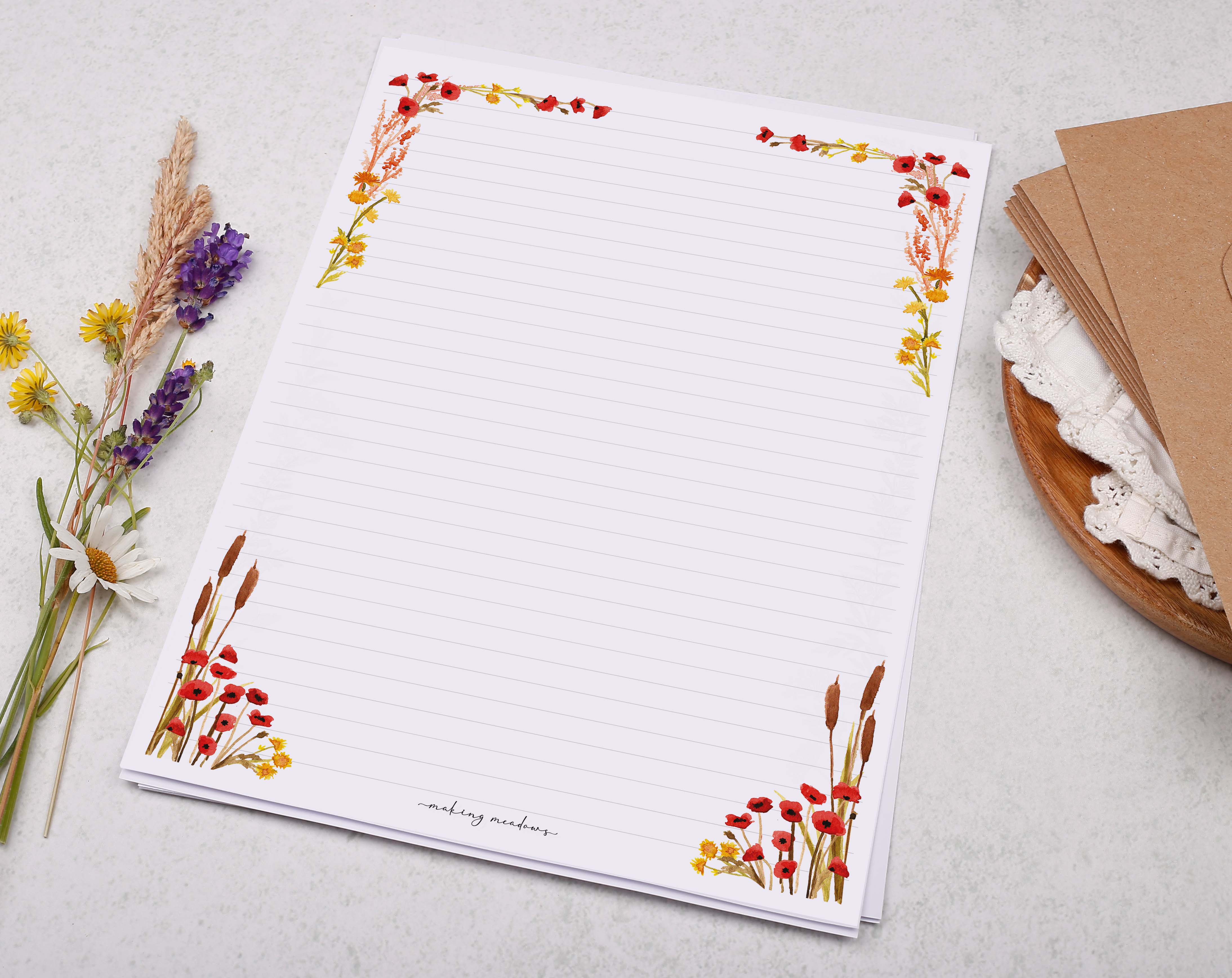 A4 writing paper with a poppy & river reed border. Stationery designed by Making Meadows
