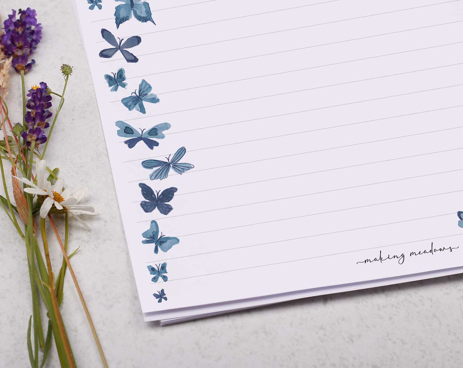 A4 writing paper with cascading butterflies. Stationery designed by Making Meadows